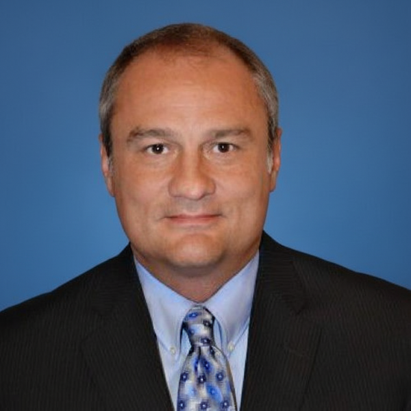 A Headshot of CEO Lane Montz with a Blue Background